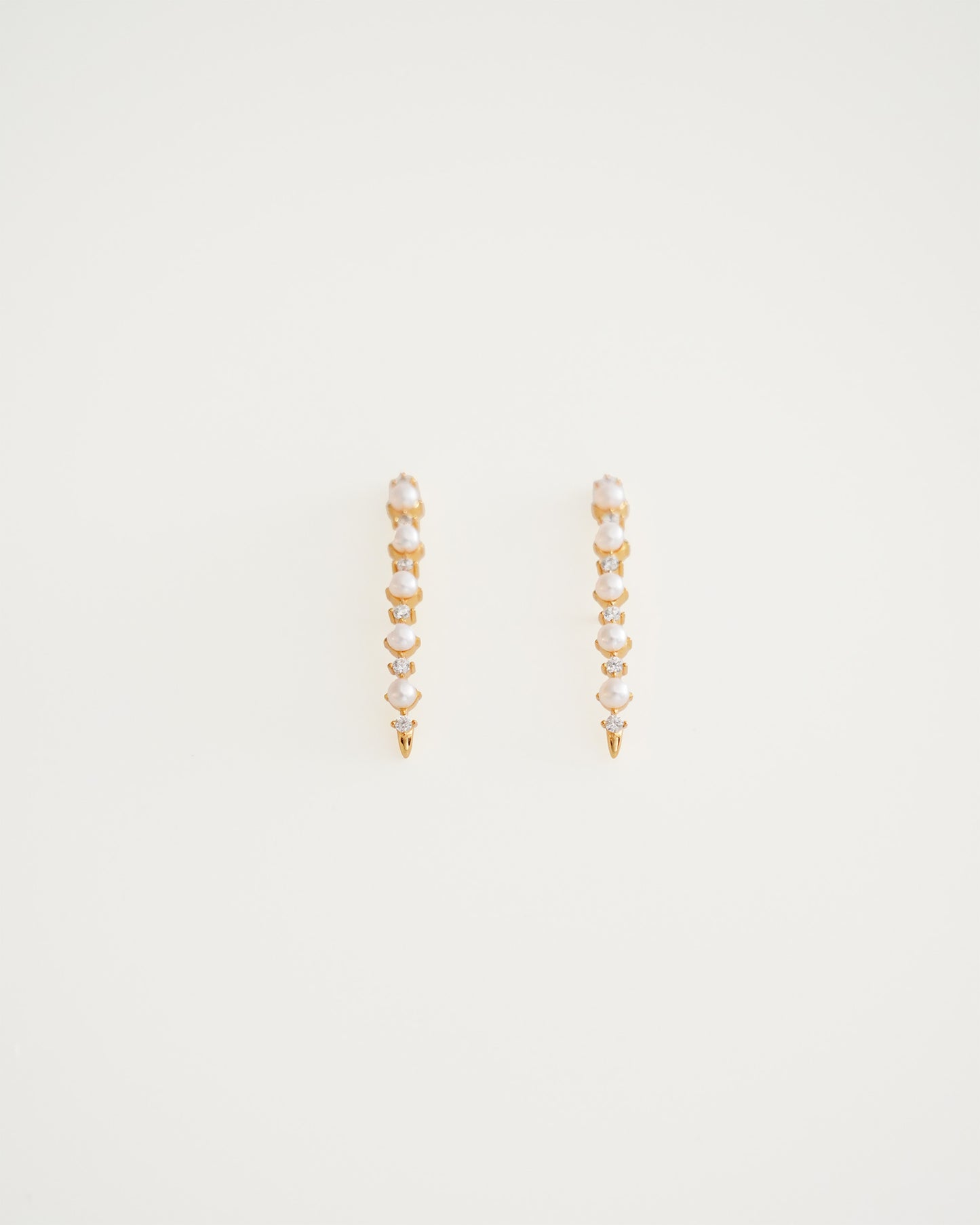 Arc Cascade Pearl Studs, close-up view