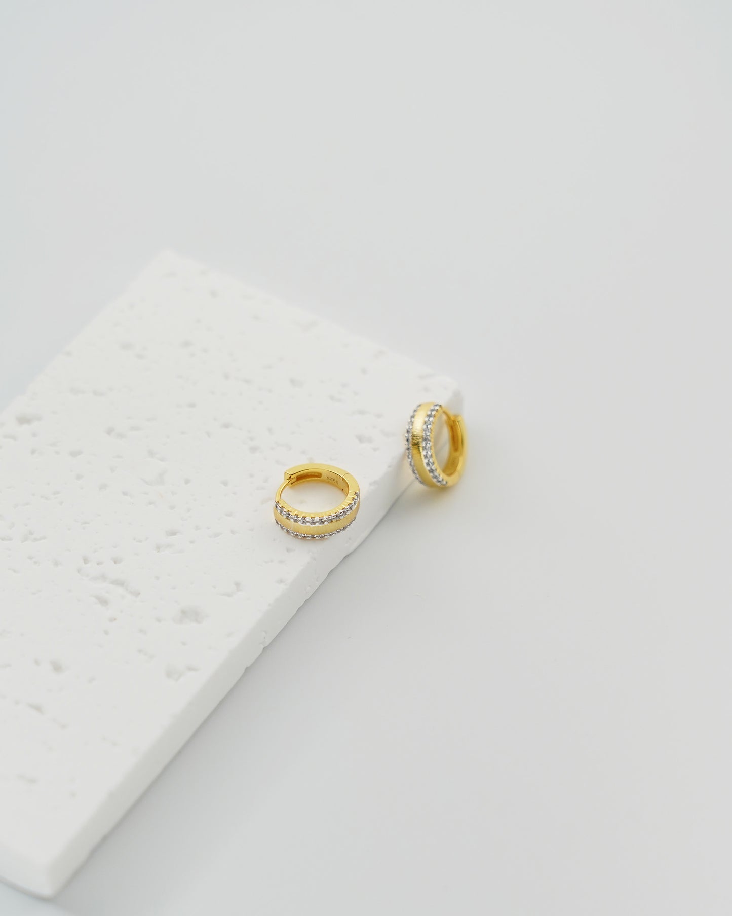 Two-Tone Brushed Gold Huggie Earrings, top view