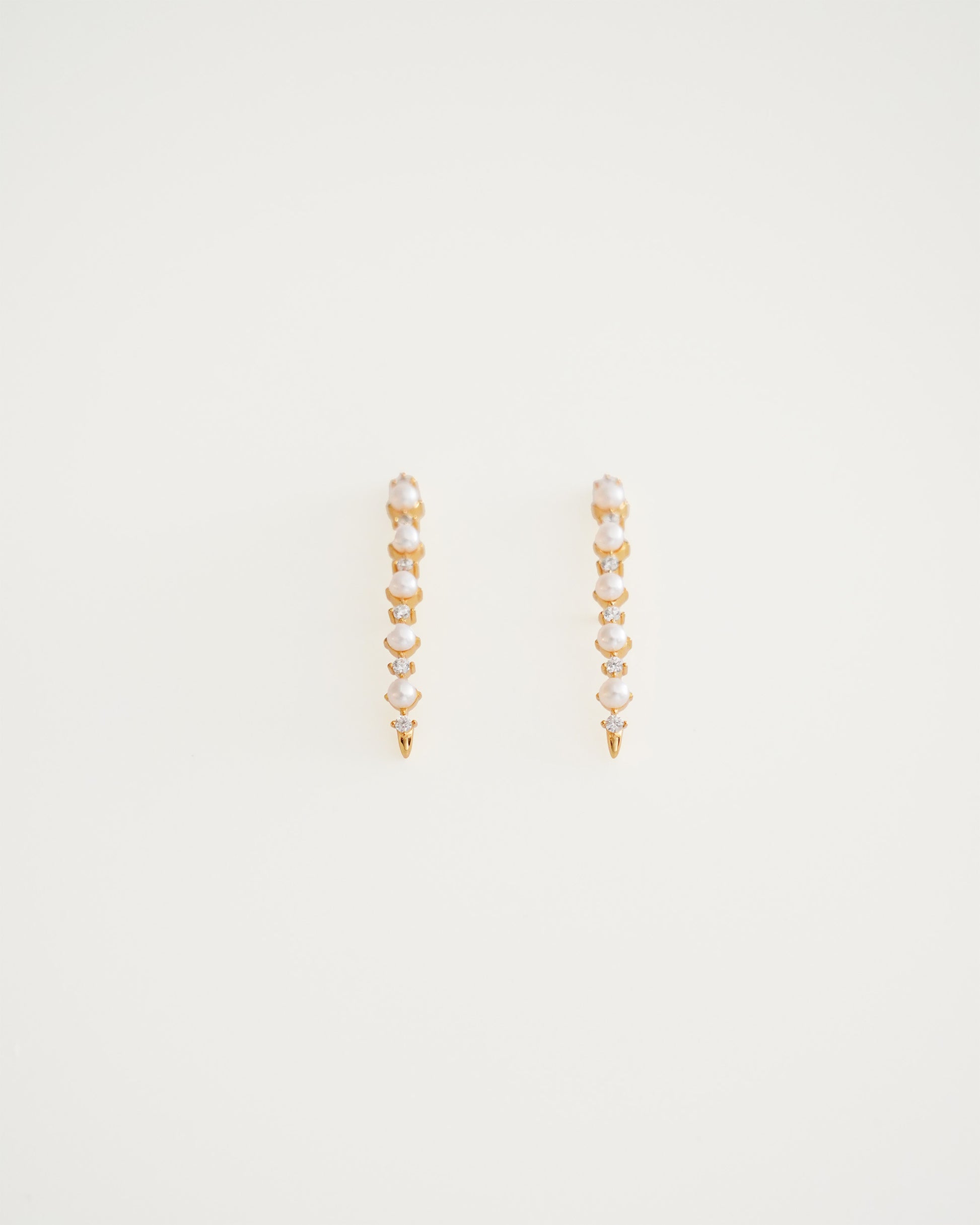 Arc Cascade Pearl Studs, close-up view